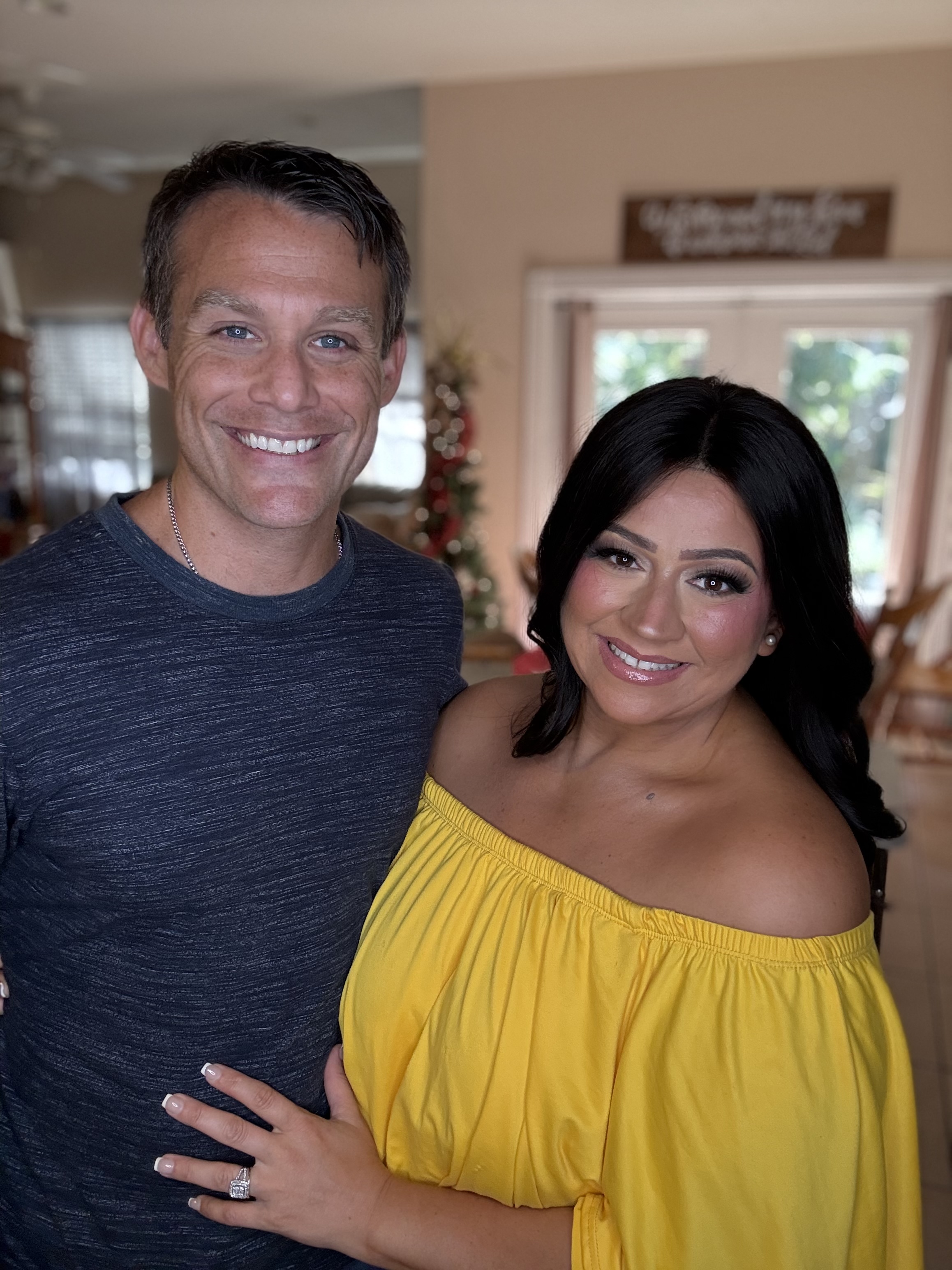 Dee and Josh Moon together in yellow, smiling